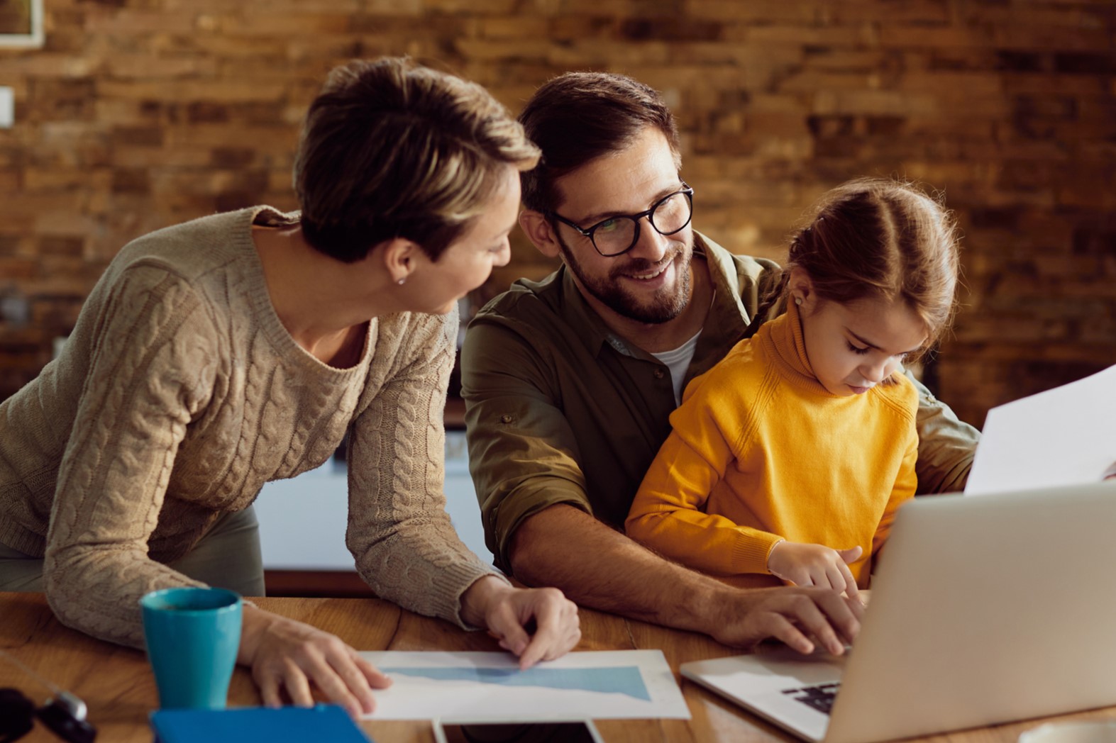 Family in front of computer